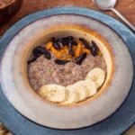Healing recipe of no oat vanilla porridge served in a ceramic bowl.
