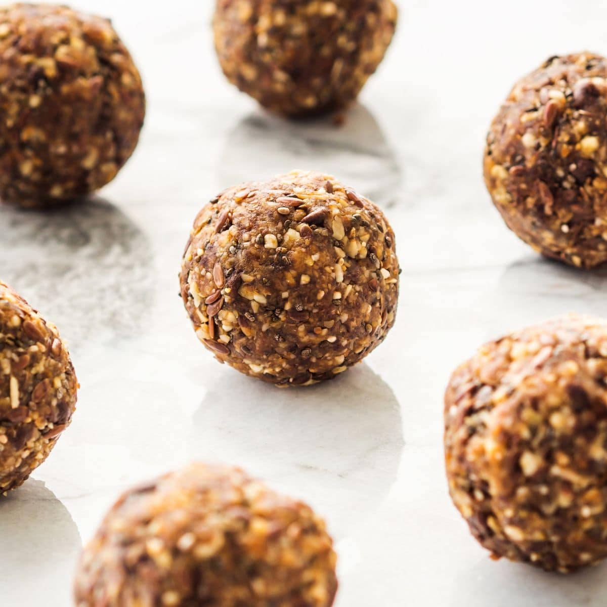 Energy bites balls recipe made with peanut butter and high in protein.
